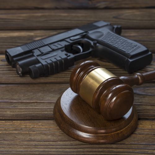 A gun and a hammer judge