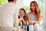 Mother and her teenager daughter talking with therapist at home concept.